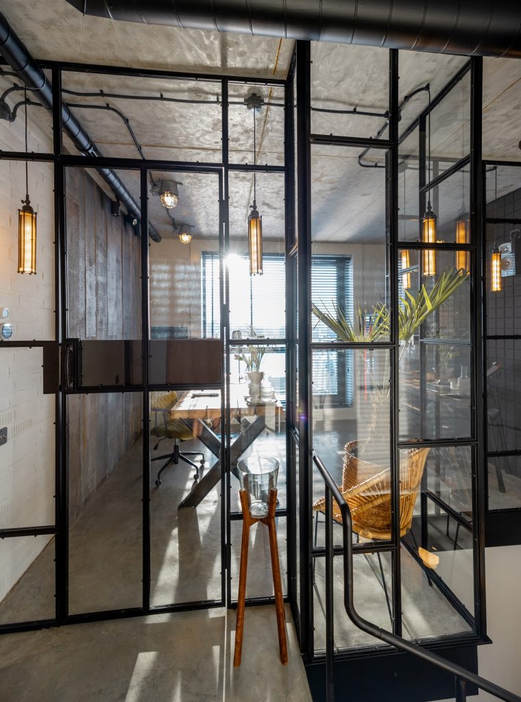 Glass partition to the home office in loft style Glass and metal partition to the home office in loft style